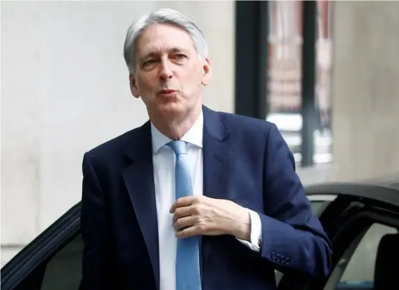  ?? (Reuters) ?? The chancellor arrives at Broadcasti­ng House in London yesterday