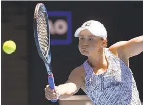  ?? ANDY BROWNBILL AP ?? Ash Barty of Australia plays a backhand return to Lucia Bronzetti of Italy during their second-round match at the Australian Open in Melbourne, Australia.