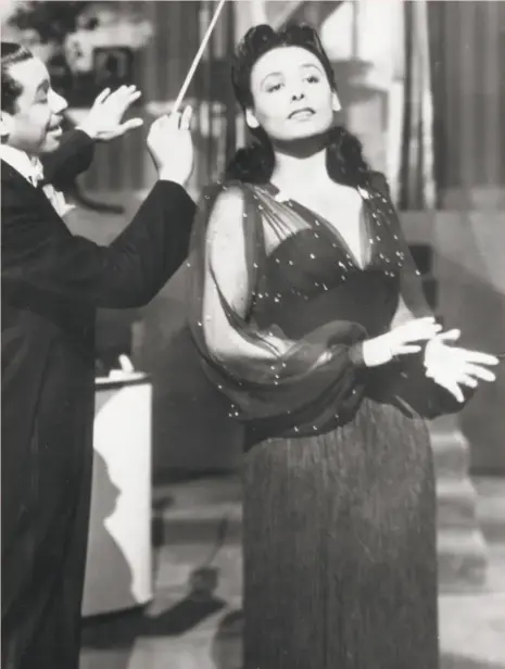  ?? AMC 1943 ?? Lena Horne, shown with Cab Calloway, sang “Stormy Weather,” in the 1943 film of the same name.