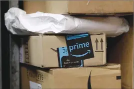  ?? Canadian Press/AP photo ?? A package from Amazon Prime is loaded for delivery on a UPS truck in New York in May.