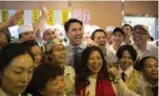  ?? CHRIS YOUNG/THE CANADIAN PRESS ?? Justin Trudeau with staff at a Chinese restaurant in Markham. Chinese Canadians have been a key base for the Conservati­ves in recent years.