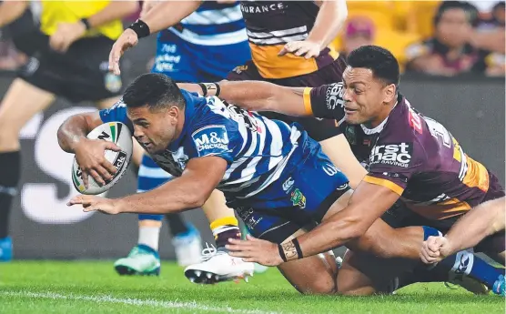  ?? IN FORM: Rising Bulldogs star Rhyse Martin scores a try against the Broncos at Suncorp Stadium in Round 9. ??