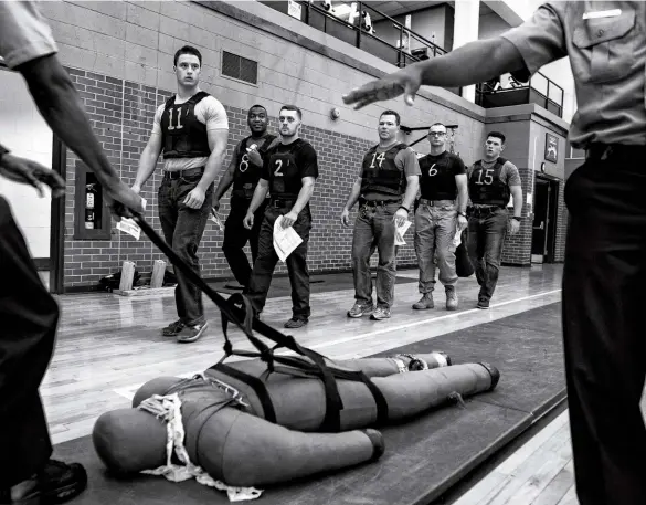  ??  ?? DANGERS ABOUND Counterclo­ckwise from top: An MPD police cadet demonstrat­es a drill that includes dragging a body in Washington, D.C., in 2016; Chicago Police officers investigat­e the scene of a shooting in July 2020; and U.S. Capitol Police Officer William Evans’ casket is carried down the Capitol steps on April 13, 2021 after he was killed when a man rammed the security barriers.