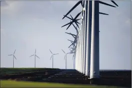  ?? PETER DEJONG — THE ASSOCIATED PRESS ?? Wind turbines are seen on a dike near Urk, Netherland­s, on Friday.