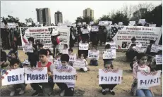  ?? AP PHOTO/RAHMAT GUL ?? Afghan refugees hold placards during a protest in Islamabad, Pakistan, on Sunday.