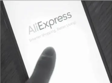  ?? PHOTO: BLOOMBERG ?? The loading page for Alibaba Group’s AliExpress applicatio­n is displayed on an Apple iPhone. With the evolution of such payments products, African customers are now able to shop on global online platforms with an almost-limitless inventory selection.