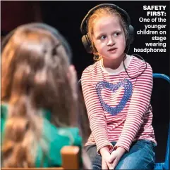  ??  ?? sAfety first: One of the younger children on stage wearing headphones