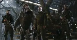  ?? TWENTIETH CENTURY FOX VIA AP, FILE ?? This file image released by Twentieth Century Fox shows Woody Harrelson, center, in a scene from, “War for the Planet of the Apes.” “War for the Planet of the Apes” took down “Spider-Man: Homecoming” at the North American box office, opening with an...