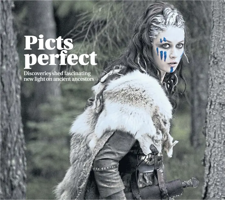  ?? Picture Cloud Nine ?? Olga Kurylenko as a painted Pictish warrior in 2009 film Centurion