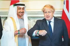  ?? WAM ?? Shaikh Mohammad Bin Zayed and Boris Johnson display the ■
Expo 2020 Dubai wristband at 10 Downing Street yesterday.