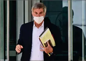  ?? (Arkansas Democrat-Gazette/Staci Vandagriff) ?? Gilbert Baker walks out of the federal courthouse in Little Rock on Thursday after the jury’s decision. Prosecutor­s said they intend to retry the counts that left jurors deadlocked.