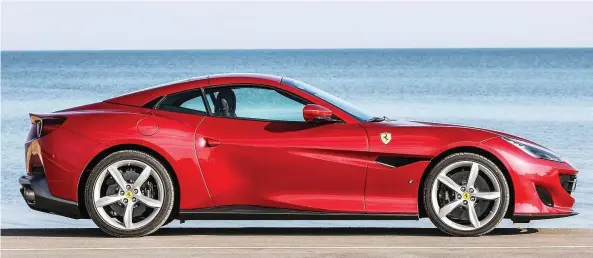  ??  ?? Despite a subdued personalit­y at low speeds, the Ferrari Portofino provides plenty of supercar credential­s with its 3.9-litre, twin-turbo V-8 engine that pumps out 592 horsepower.