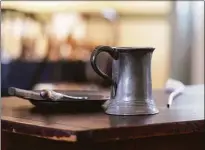  ?? ?? A tankard, plate, knife & fork, part of a new exhibit at The Keeler Tavern Museum & History Center.