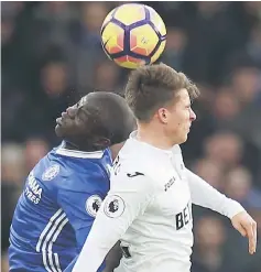  ??  ?? Chelsea’s N’Golo Kante (left) in action with Swansea City’s Tom Carroll during the English Premier League match at Stamford Bridge in London, in this Feb 25 file photo. — Reuters photo