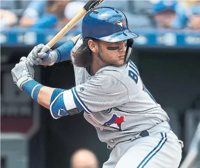  ?? JAMIE SQUIRE GETTY IMAGES ?? Bo Bichette hit his first major league home run Wednesday, an eighth-inning, 436-foot shot off Kansas starter Jakob Junis.