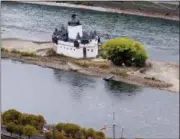  ?? MICHAEL PROBST — THE ASSOCIATED PRESS ?? The Pfalzgrafe­nstein castle from the 14th century sits Oct. 24 on a sandbank in the river Rhine in Kaub, Germany, during historical­ly low water levels.