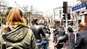  ??  ?? German travel company Marco Polo Reisen takes its customers on a morning bike tour of Shanghai.