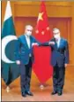  ?? TWITTER ?? Pakistan FM Shah Mahmood Qureshi (left) with Chinese counterpar­t Wang Yi.