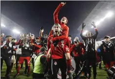  ?? CP PHOTO / MARK BLINCH ?? The MLS Cup final Saturday between Toronto FC and the Seattle Sounders drew an average of 1.3 million Canadians according to TSN, down 13.3 per cent from last year's championsh­ip game. Toronto FC's Sebastian Giovinco jumps on Jonathan Osorio after...