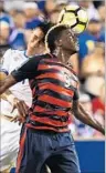  ?? Nicholas Kamm AFP/Getty Images ?? GYASI ZARDES of the U.S. team battles Bryan Tamacas of El Salvador in July.