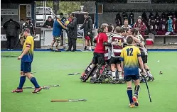  ?? BRADEN FASTIER/STUFF ?? North Harbour celebrate beating Bay of Plenty 2-0 in the final of the national under-15 premier boys’ hockey final in Nelson.