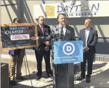  ?? JEREMY P. KELLEY / STAFF ?? Ohio Democratic Party Chairman David Pepper speaks at a news conference outside Dayton Public Schools headquarte­rs on Tuesday, flanked by Ohio House candidate James Calhoun (left) and State Sen. Joe Schiavoni.
