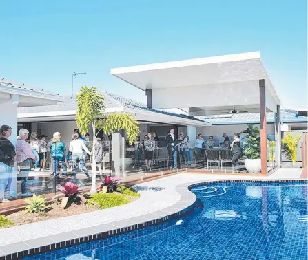  ?? Picture: SUPPLIED ?? More than 100 people attended the auction at 24 Cadence Ave, Mermaid Waters on Saturday.