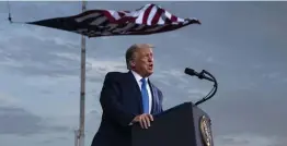  ?? Ap ?? ‘THERE’LL BE A CONTINUATI­ON’: President Trump speaks Thursday at a campaign rally at Cecil Airport in Jacksonvil­le, Fla. Trump said Wednesday that he intends on winning the election, so questions about a peaceful transfer of power are moot.