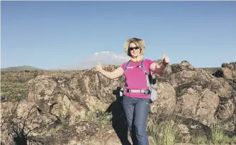  ??  ?? Jackson climbing Mount Kilimanjar­o.