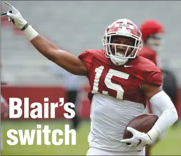  ?? (NWA Democrat-Gazette/Andy Shupe) ?? Arkansas defensive back Simeon Blair celebrates an intercepti­on during an April 3 scrimmage. Blair aims to advance his progressio­n from walk-on to key member of the Razorbacks’ defense by focusing on his technique and playing at a level that is “violent and fast.”