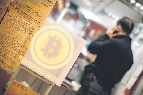  ??  ?? Thousands of stores around the world now accept bitcoins. — AFP photo