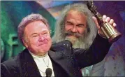  ?? REED SAXON / ASSOCIATED PRESS 1997 ?? Roy Clark, shown with the Pioneer Award at the 1997 Academy of Country Music Awards, died Thursday at home in Oklahoma, his publicist said.