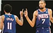  ?? STIER/GETTY
SARAH ?? Last season, Kyrie Irving (left) watched, Ben Simmons waited and Kevin Durant (right) wilted. But here are the Nets again, perhaps ready, wiling and able to meet the challenges of the Heat and the rest of the NBA Eastern Conference.