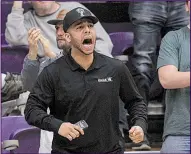  ?? Arkansas Democrat-Gazette/BENJAMIN KRAIN ?? Desmond Howard cheers for his brother Jordan during Wednesday night’s game in Conway. Another brother, Markus, is a sophomore guard at Marquette.