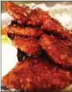  ?? PHOTO PROVIDED ?? For people who like traditiona­l bar food, Berben & Wolff’s offers vegan seitan wings at its deli on Lark Street in ALbany.