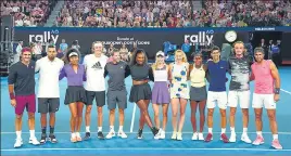  ?? AP ?? Players pose for a photo during the Rally For Relief at Rod Laver Arena in Melbourne on Wednesday.