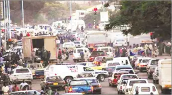  ??  ?? A TYPICAL SCENE AT THE MBUDZI ROUNDABOUT . . . The mere thought that one will need to pass through this roundabout is as stressful as it is frightenin­g because besides the unbearable delays motorists have to endure, there is the risk of side-swiping as...