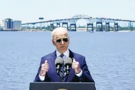  ?? ALEX BRANDON/AP ?? President Biden says he’s “ready to compromise” on his plan during a speech Thursday in Lake Charles, Louisiana. Behind Biden is the aging Calcasieu River Bridge on I-10.