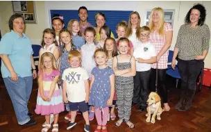  ??  ?? Staff and children from Walthew House’s youth club celebrate five years