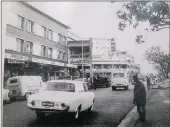  ??  ?? VIBRANT: The Warwick Avenue area in the 1970s. The Kajimusa building is on the left, and further up the road was Singh’s Mutton Market, Johns Building and Himalaya House.
