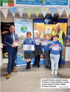  ?? LLANELI ROTARY ?? Llanelli Rotary project leader Dr Kevin Jones delivers copies of the book to Swiss Valley Primary School.