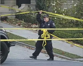  ?? Eric Risberg Associated Press ?? A POLICE OFFICER closes the area near the San Francisco home where Paul Pelosi was attacked and severely beaten by an assailant with a hammer on Oct. 28.