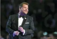  ?? PHOTO BY MATT SAYLES — INVISION — AP ?? In this file photo, James Corden hosts at the 60th annual Grammy Awards at Madison Square Garden in New York. Corden brings a gleeful buoyancy to his CBS late- night show. That’s the case whether he’s bantering with all his guests at once or singing...