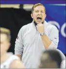  ??  ?? UNLV coach T.J. Otzelberge­r calls a play against Utah State in Thursday’s quarterfin­als game at Thomas & Mack Center, a game that ended with a blowout loss.