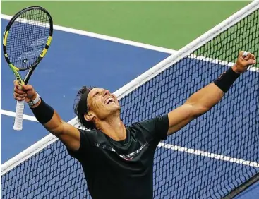  ?? Seth Wenig / Associated Press ?? Rafael Nadal of Spain savors the moment after beating Kevin Anderson of South Africa on Sunday to win the men’s title at the U.S. Open — his second Grand Slam crown of the year and the 16th of his career.