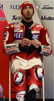  ??  ?? Speedster: Italy’s Andrea Dovizioso looking at a monitor during the free practice session for the Japanese MotoGP Grand Prix in Motegi yesterday. — AP