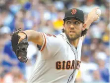  ?? Morry Gash / Associated Press ?? The Giants’ Madison Bumgarner said he may have been feeling some effects from taking a liner above his left elbow on July 6.
