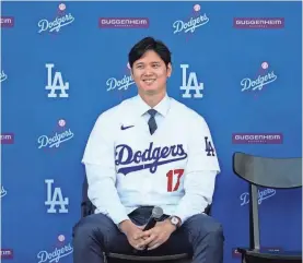  ?? AP ?? The Dodgers’ Shohei Ohtani answers questions during a news conference at Dodger Stadium on Dec. 14 in Los Angeles.