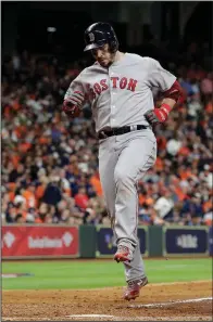  ?? AP/DAVID J. PHILLIP ?? Steve Pearce of the Boston Red Sox celebrates after hitting a home run Tuesday night that broke a 2-2 tie in the sixth inning and helped lift the Red Sox to a 8-2 victory over the Houston Astros in Game 3 of the American League Championsh­ip Series.