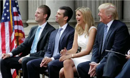  ?? Photograph: Gary Cameron/Reuters ?? Trump with sons Eric and Donald Jr and daughter Ivanka at the ground-breaking of the Trump hotel in 2014. The hotel became a magnet for controvers­y.